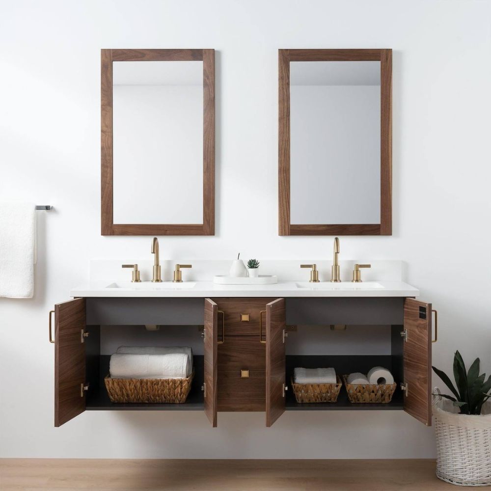 Bathroom vanity with open cabinets, mirrors, and toiletries on a white wall.