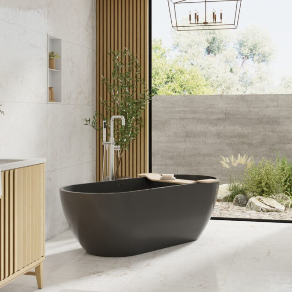 A matte black freestanding bathtub placed in a modern bathroom with light wood slat cabinetry, a tall chrome faucet, and a large window opening to an outdoor garden scene.
