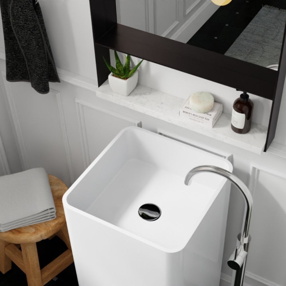 White freestanding sink with chrome finish faucet