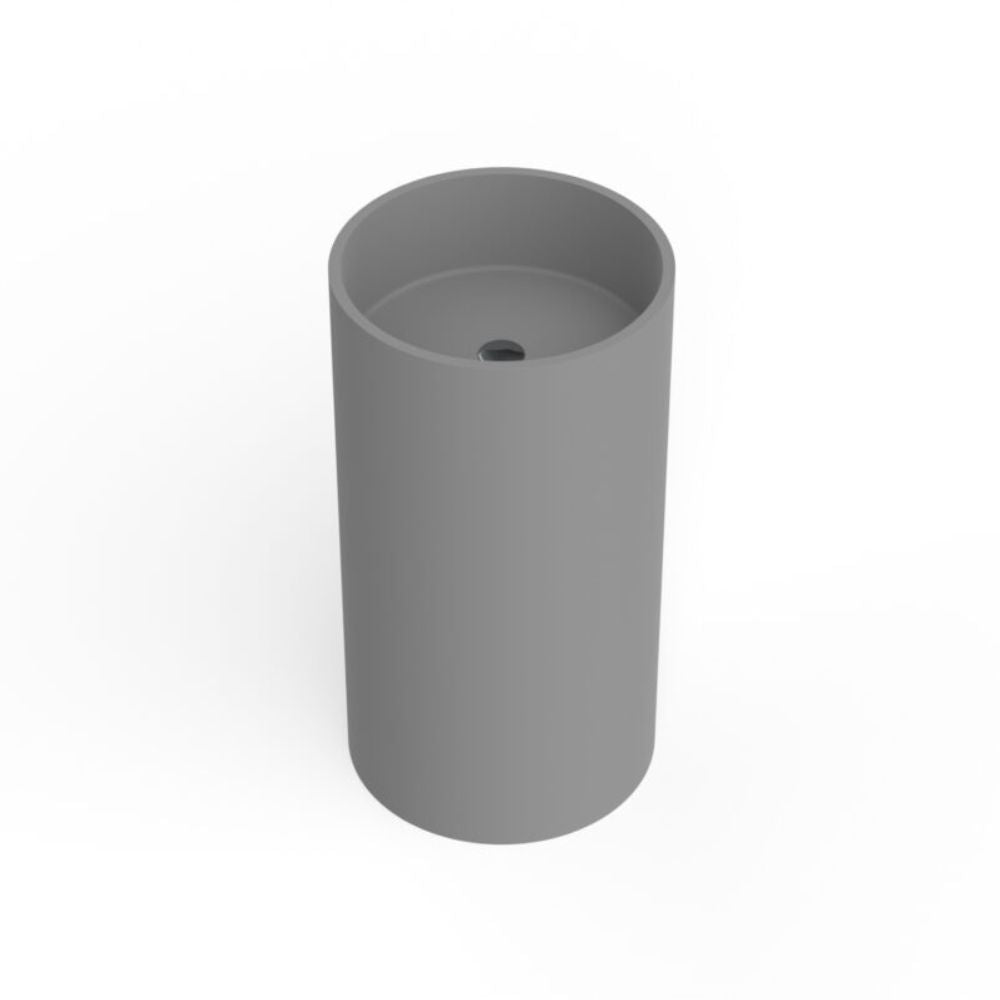 A minimalist gray cylindrical pedestal sink with a smooth matte finish and a small drain hole at the top, shown on a clean white background.