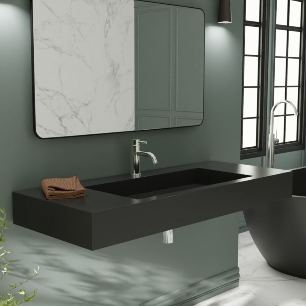 Modern bathroom with black sink, mirror, and bathtub.
