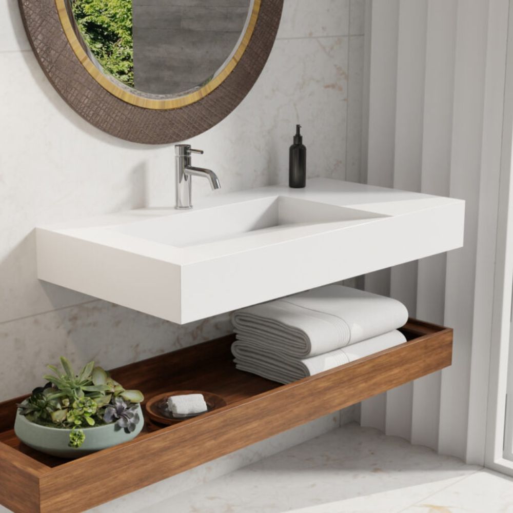 Bathroom vanity with sink, towels, and decorative items on a wooden shelf.