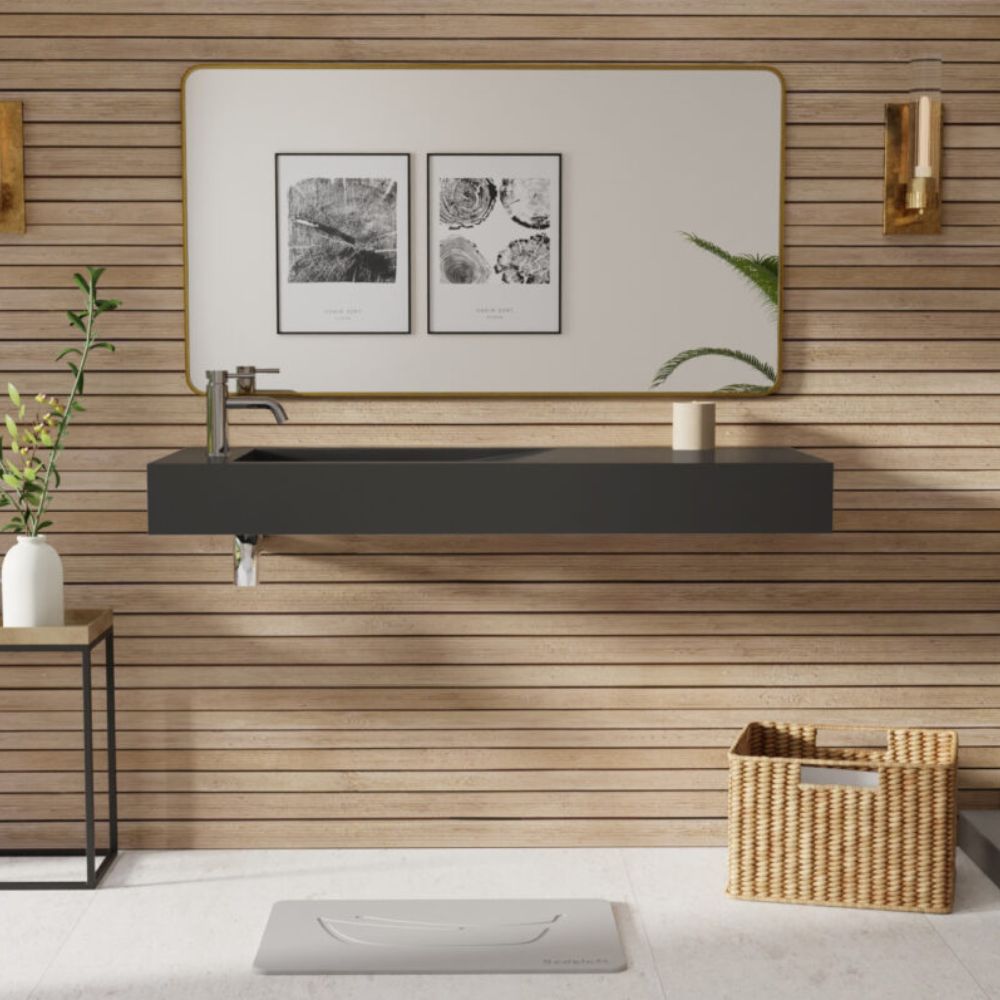 Modern bathroom with wooden wall, black sink, and decorative elements.