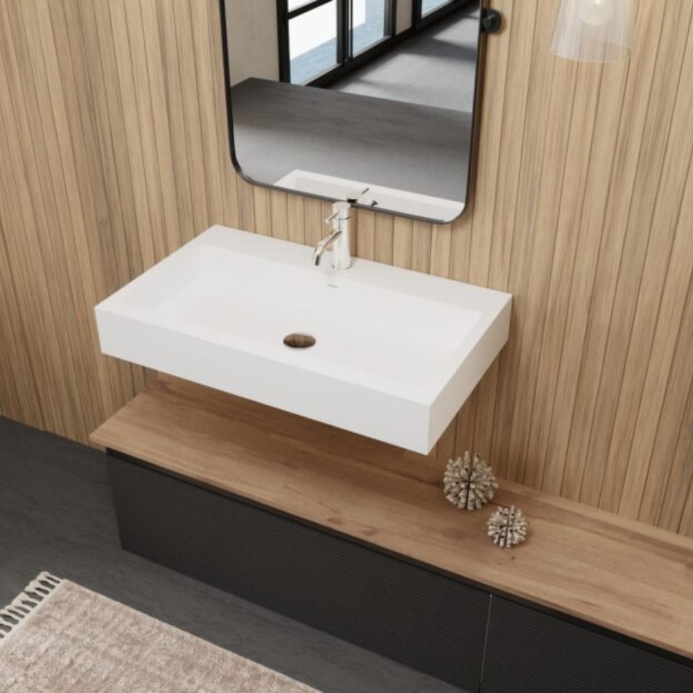 Bathroom vanity with white sink and mirror against a wooden wall.