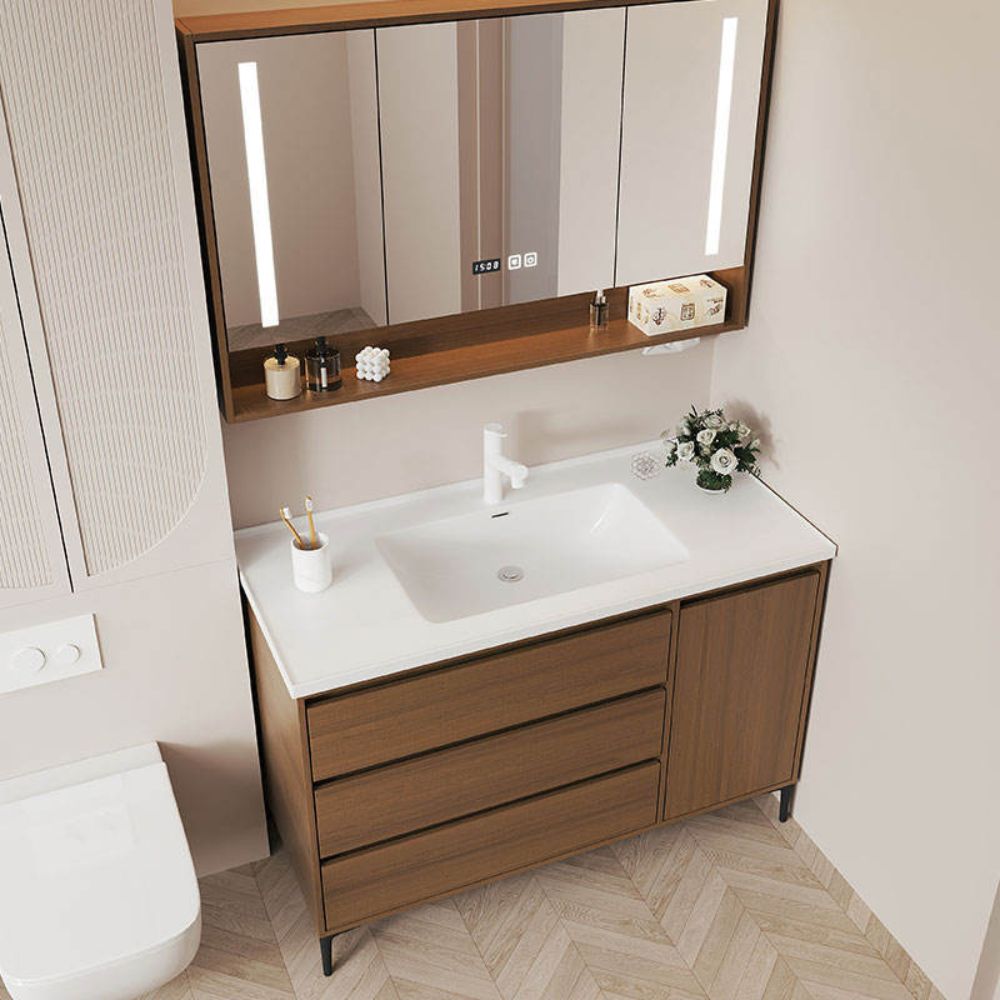 Bathroom vanity with sink, mirror, and decorative items.
