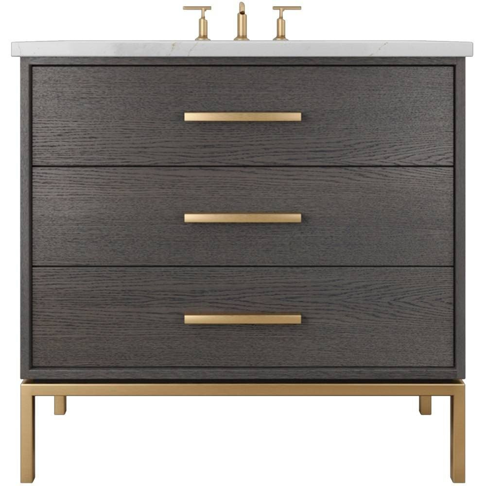 Bathroom vanity with three drawers, gold handles, and a white countertop.