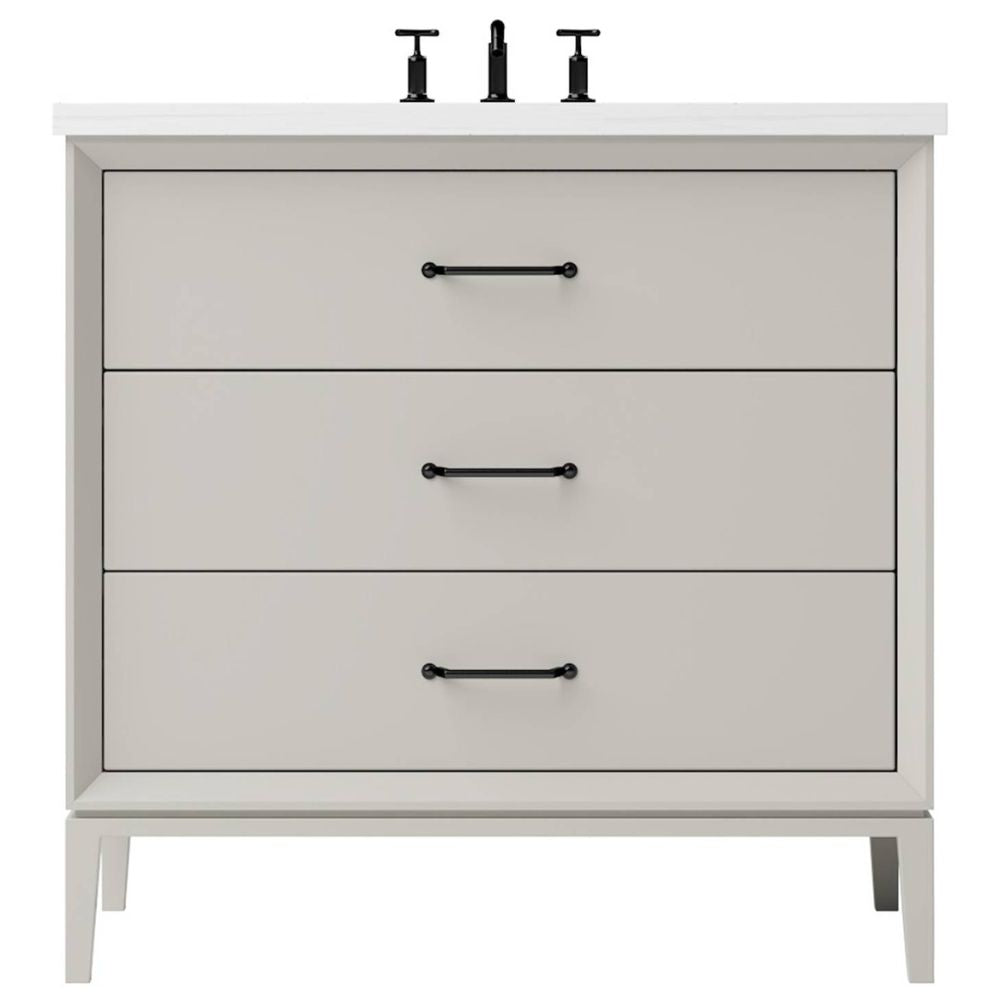 White bathroom vanity with three drawers and black handles on a white background