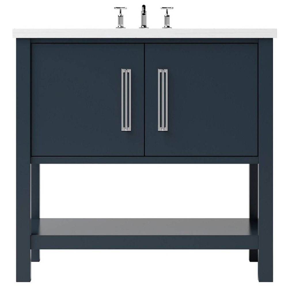 Blue bathroom vanity with white countertop and silver fixtures on a white background